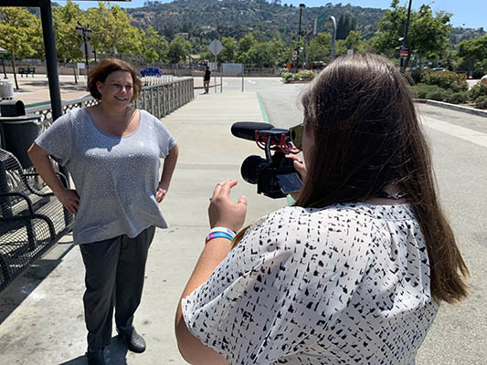 A woman being filmed in Barcelona Spain